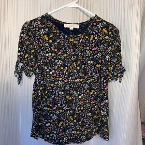 Women’s floral blouse with tie sleeves